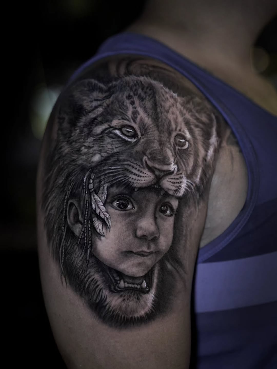 Lion and child portrait tattoo, shoulder