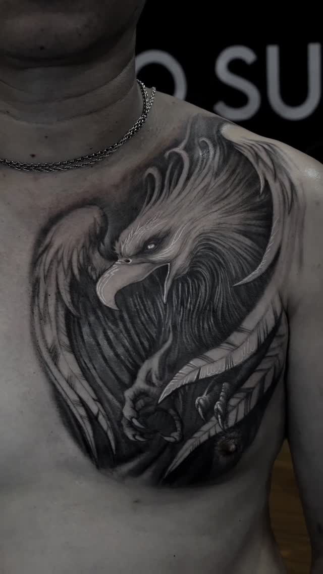 Black-and-grey eagle chest tattoo, freehand cover-up