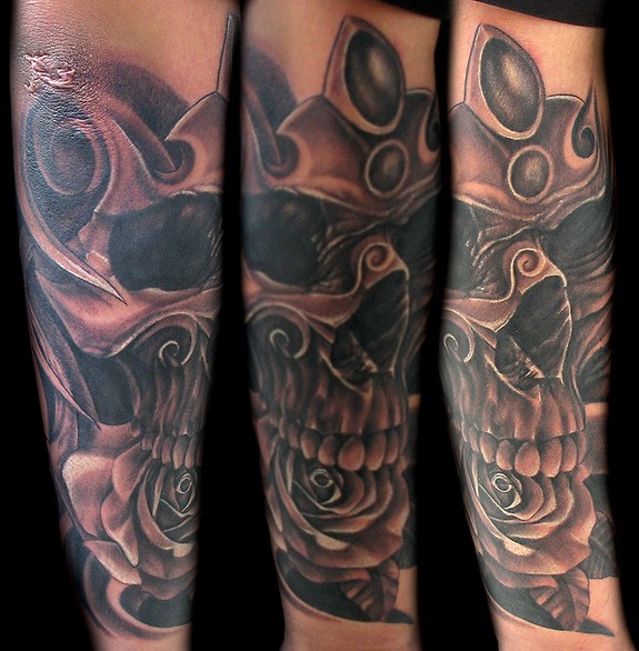 Skull on arm with Crown and Rose in Mouth