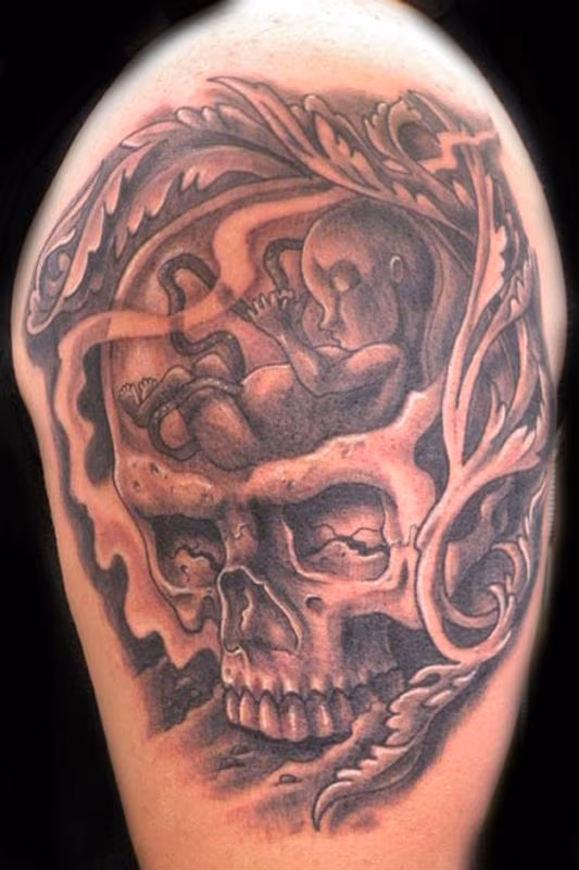 skull with fetus tattoo