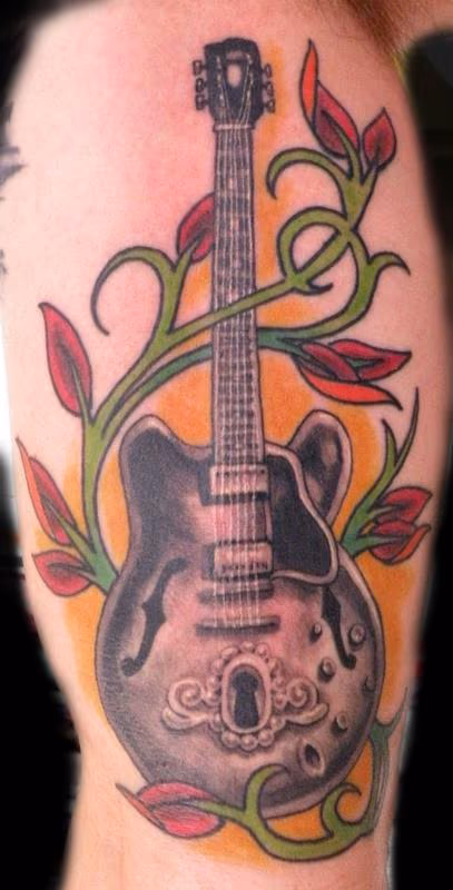 guitar and key hole tattoo