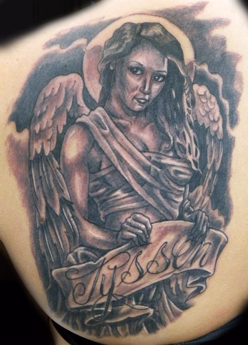 black and gray angel tattoo
