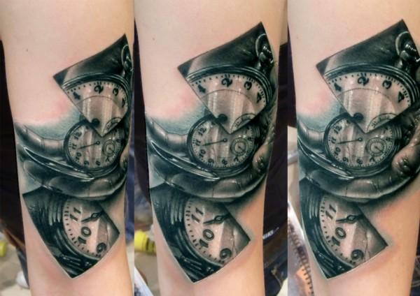 Watch in hand tattoo