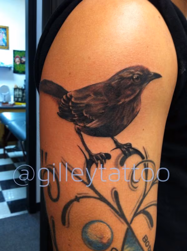 realistic black and grey bird tattoo