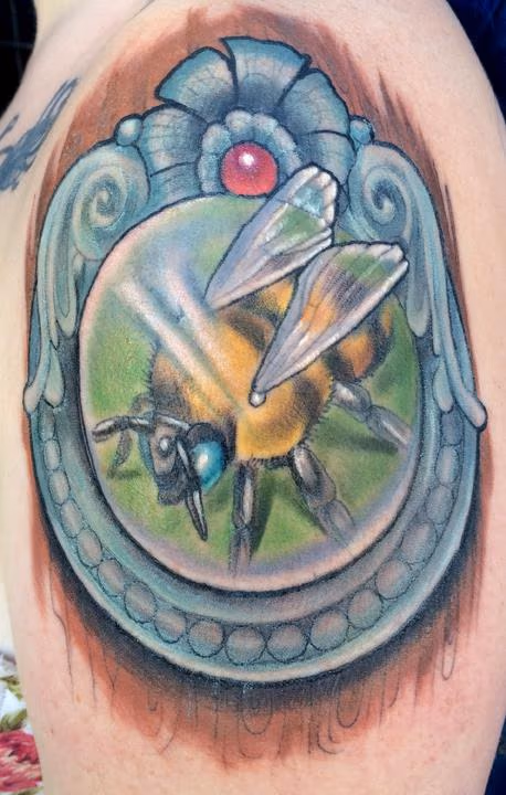 Bee in a frame tattoo