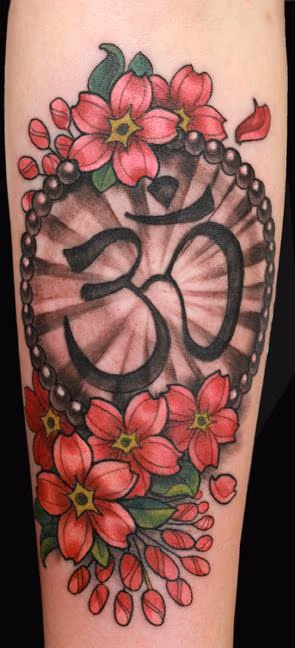 Om and cherry blossom tattoo