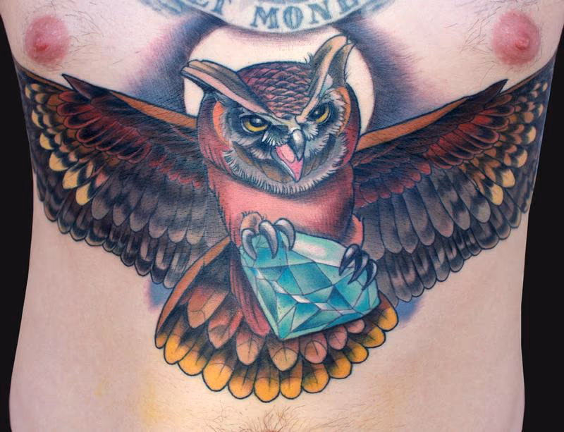 Owl holding diamond tattoo