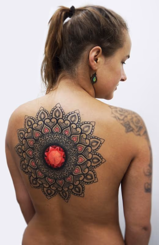 ornamental dotwork mandala with crystal centre on the back