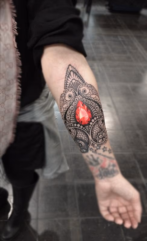 ornamental bongo style dotwork linework with crystal centrepiece