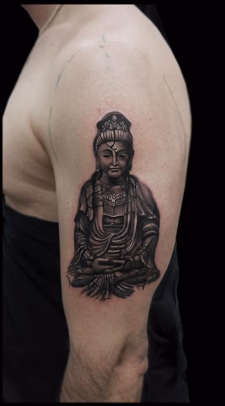 black and grey realistic broken sculpture buddha tattoo