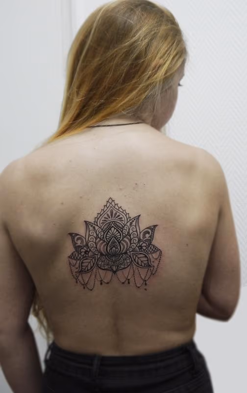 dotwork linework ornamnetal lotus tattoo in bongo style