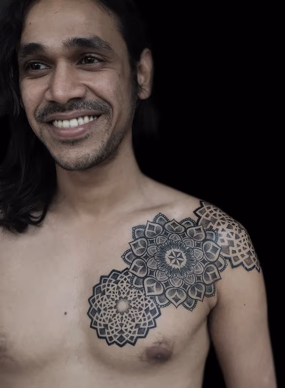 dotwork indian traditional mandala chest pattern tattoo