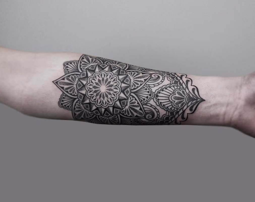 dotwork linework bongo style forearm tattoo