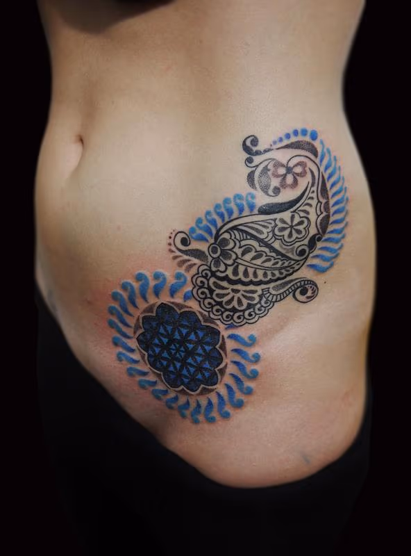 bongo style dotwork linework traditional indian custom paisley flower of life tattoo