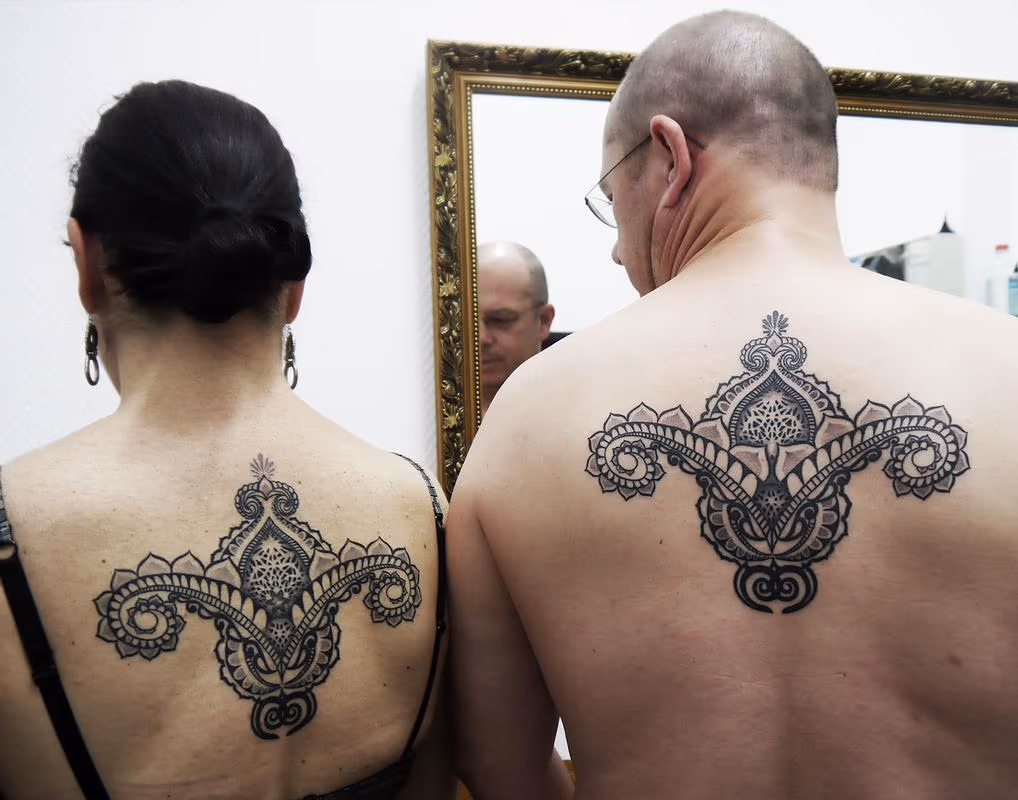 couple tattoo in bongo style indian traditional dotwork linework tattoo