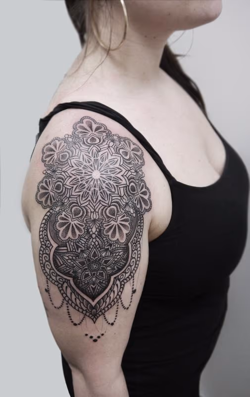 dotwork linework ornamental arm shoulder tatto in indian traditional style