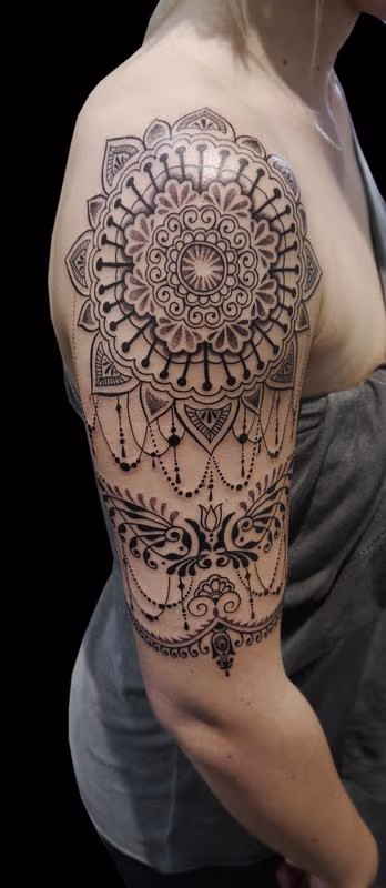 dotwork linework ornamental bongo style half sleeve tattoo