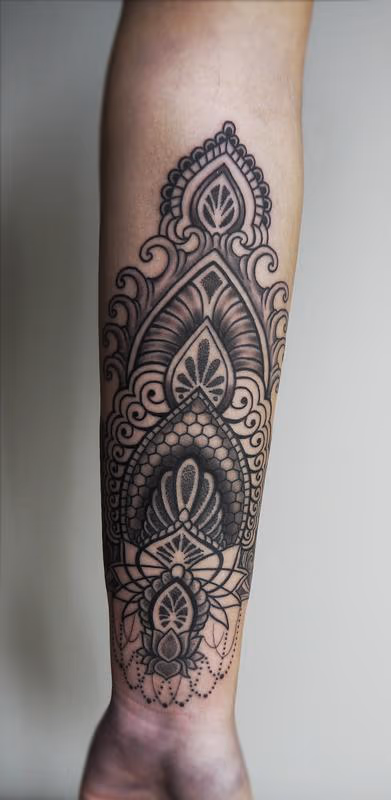 dotwork linework indian traditional ornamental tattoo on the forearm