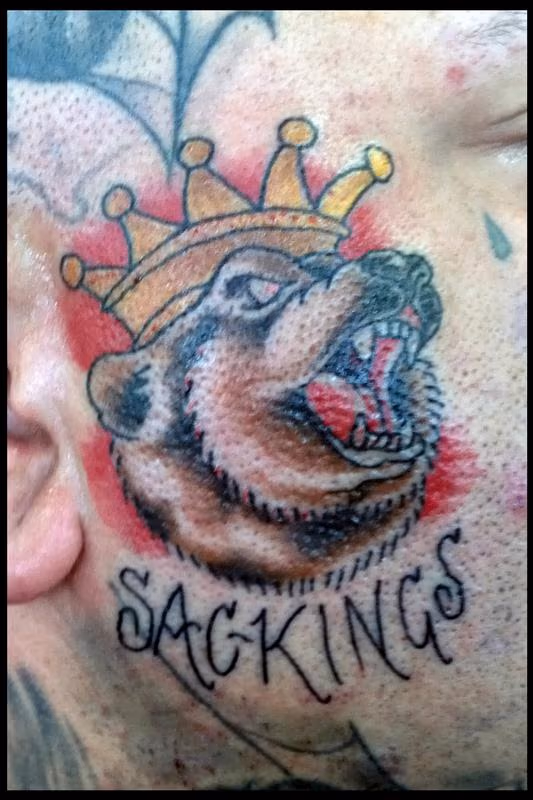 Profits Face Tattoo