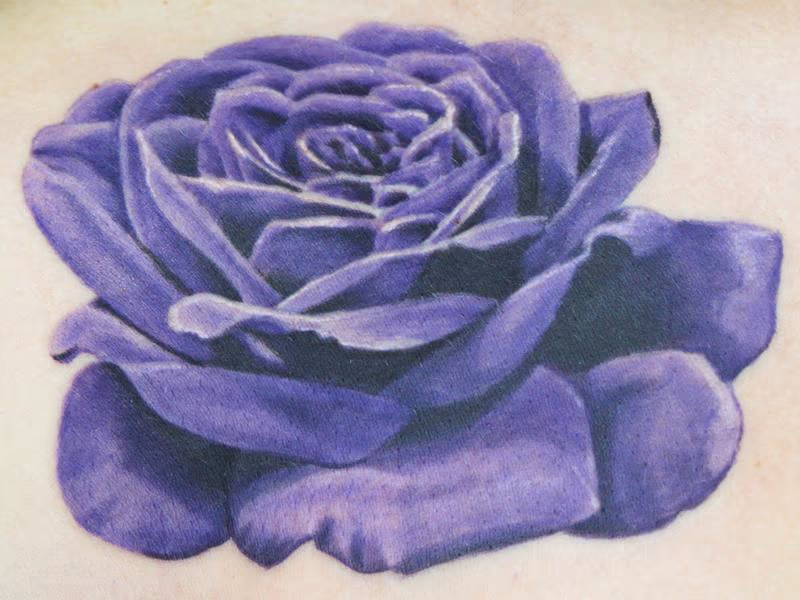 Purple rose on a woman's chest