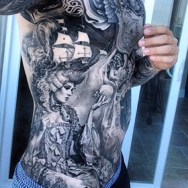 Carlos Torres Rib Tattoo