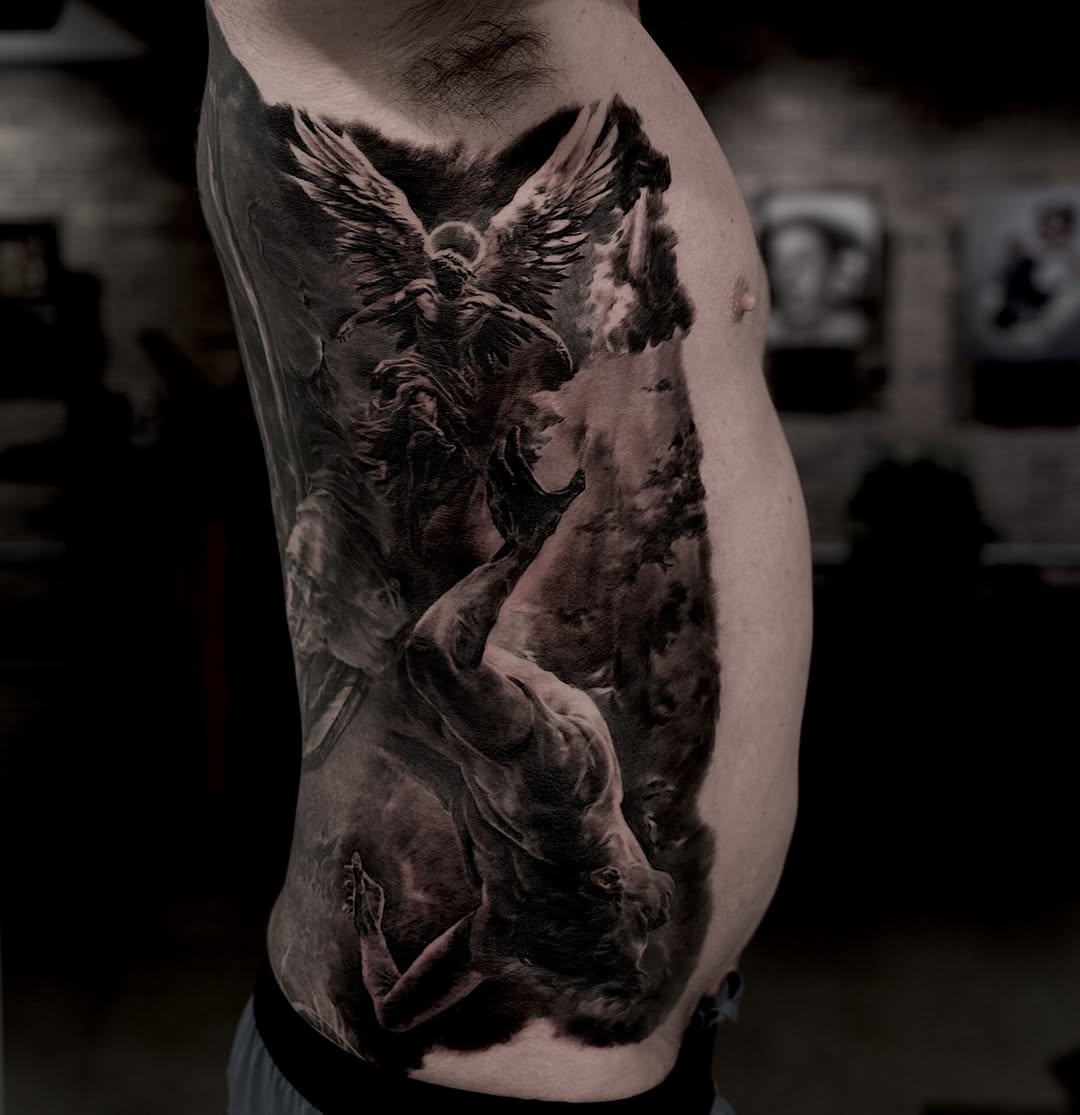 Fallen angel rescue black-and-grey side tattoo