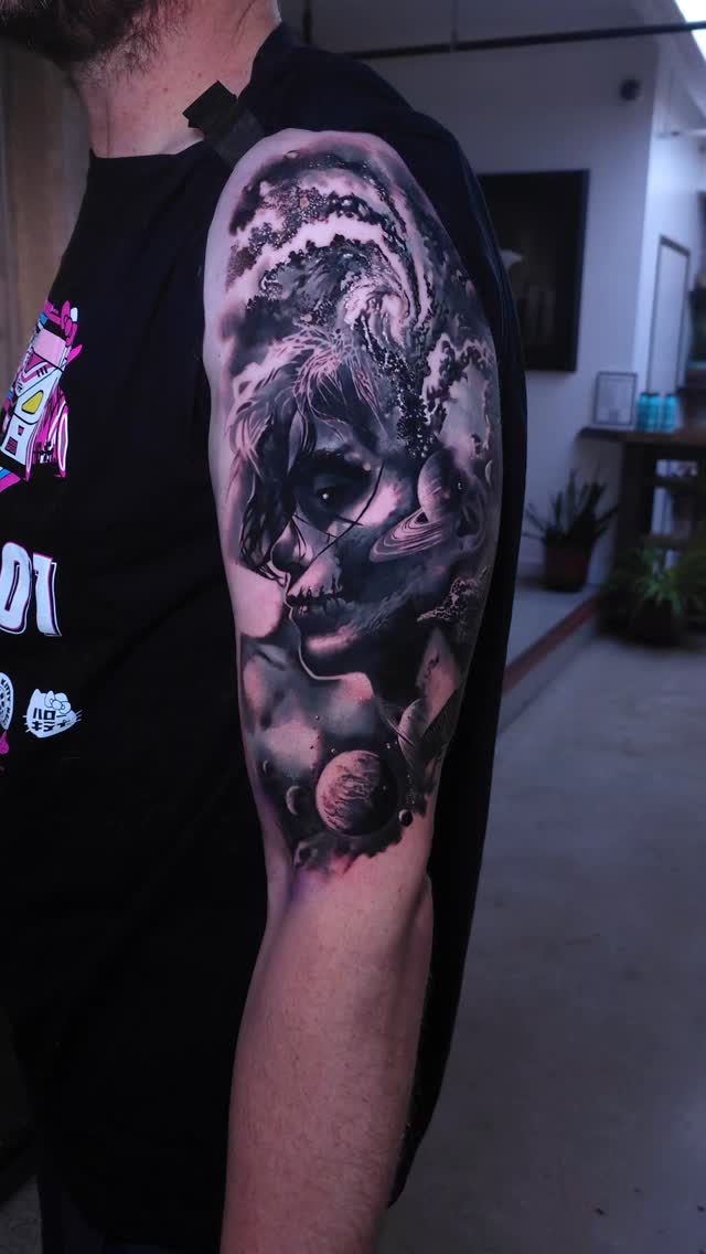 Black-and-grey surreal portrait half-sleeve