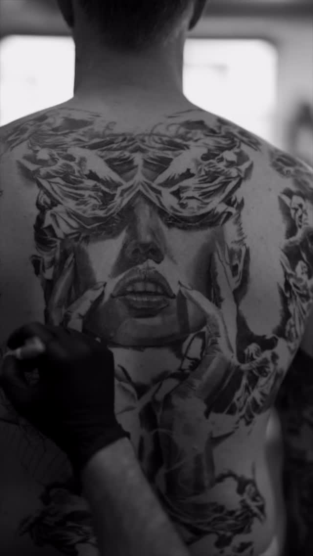 Black-and-grey portrait back piece in progress