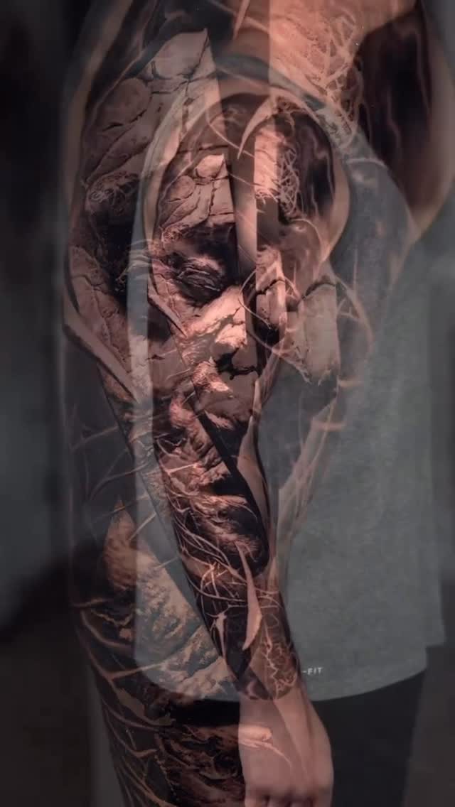 Black-and-grey portrait sleeve with surreal overlay