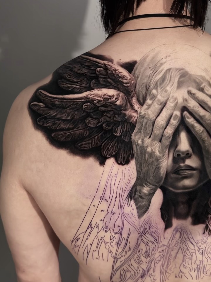 Black-and-grey portrait and wings back piece