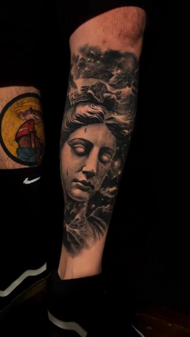 Black-and-grey portrait leg piece, healed