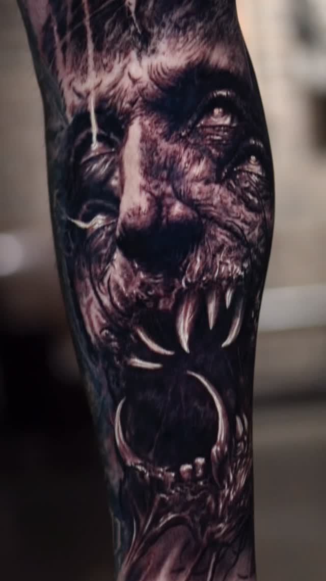Black-and-grey horror portrait tattoo, forearm