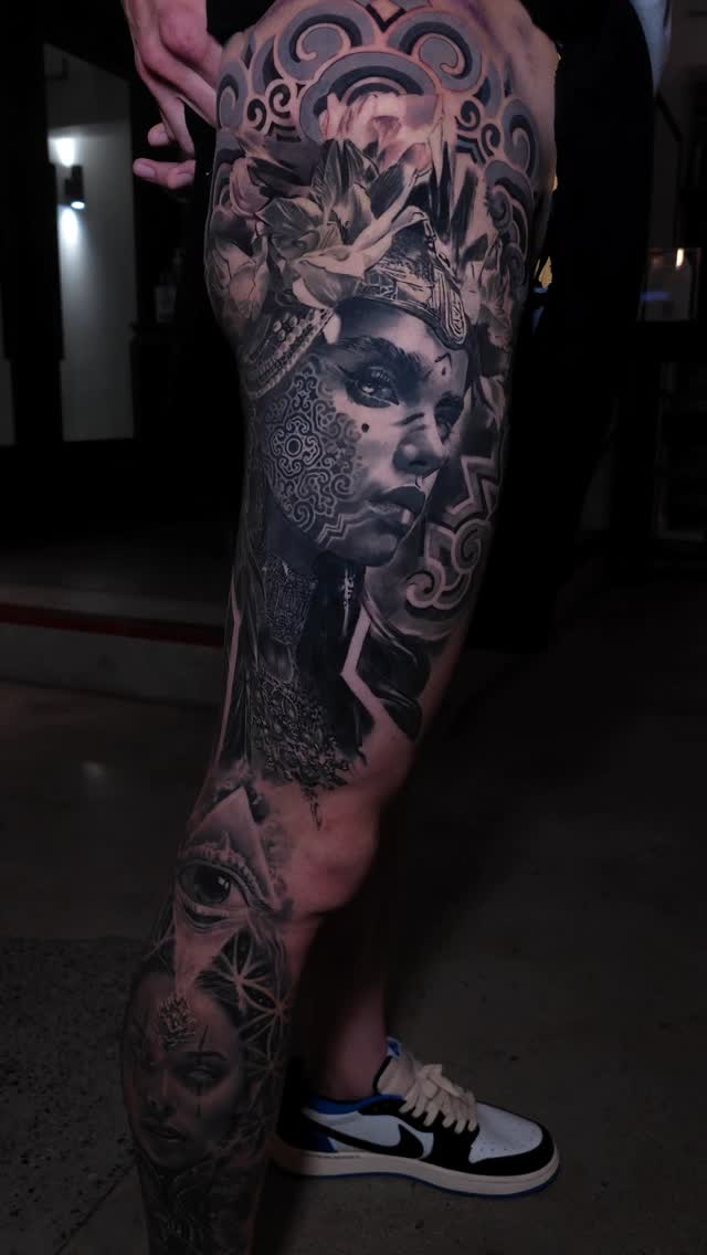 Black-and-grey portrait leg sleeve with ornamental details