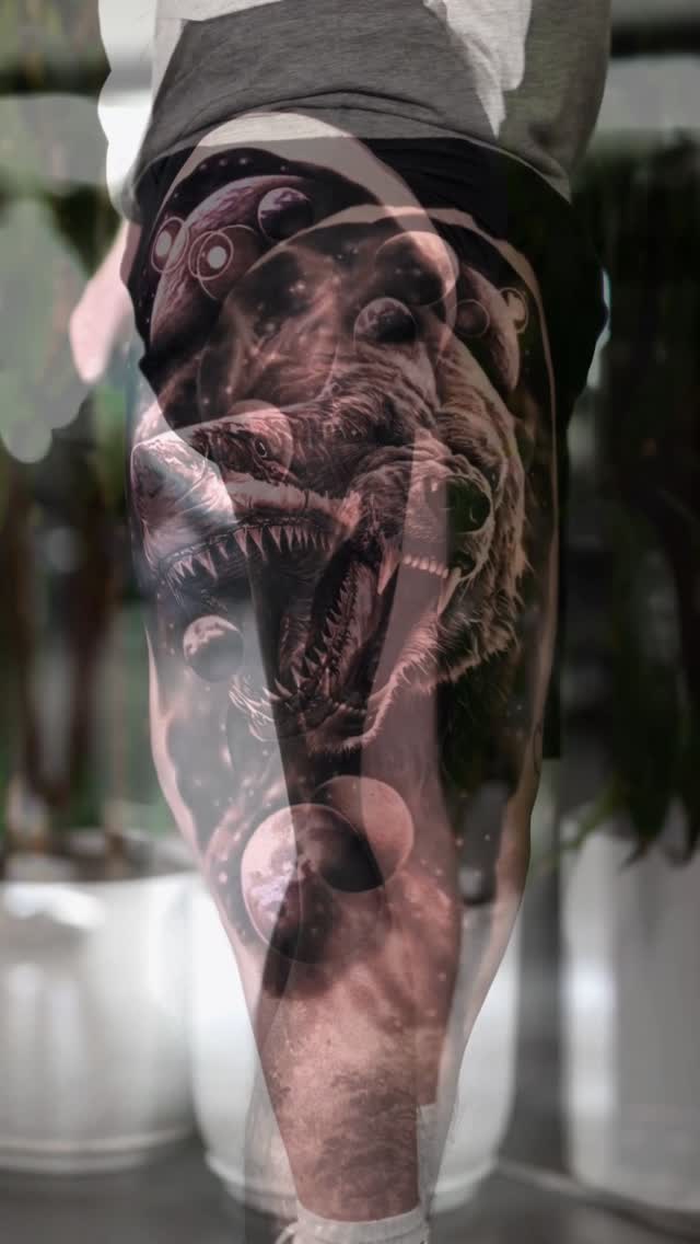 Black-and-grey demon skull thigh tattoo