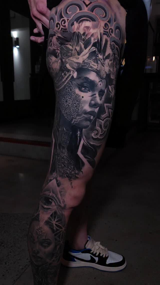 Black-and-grey portrait leg sleeve with ornamental details