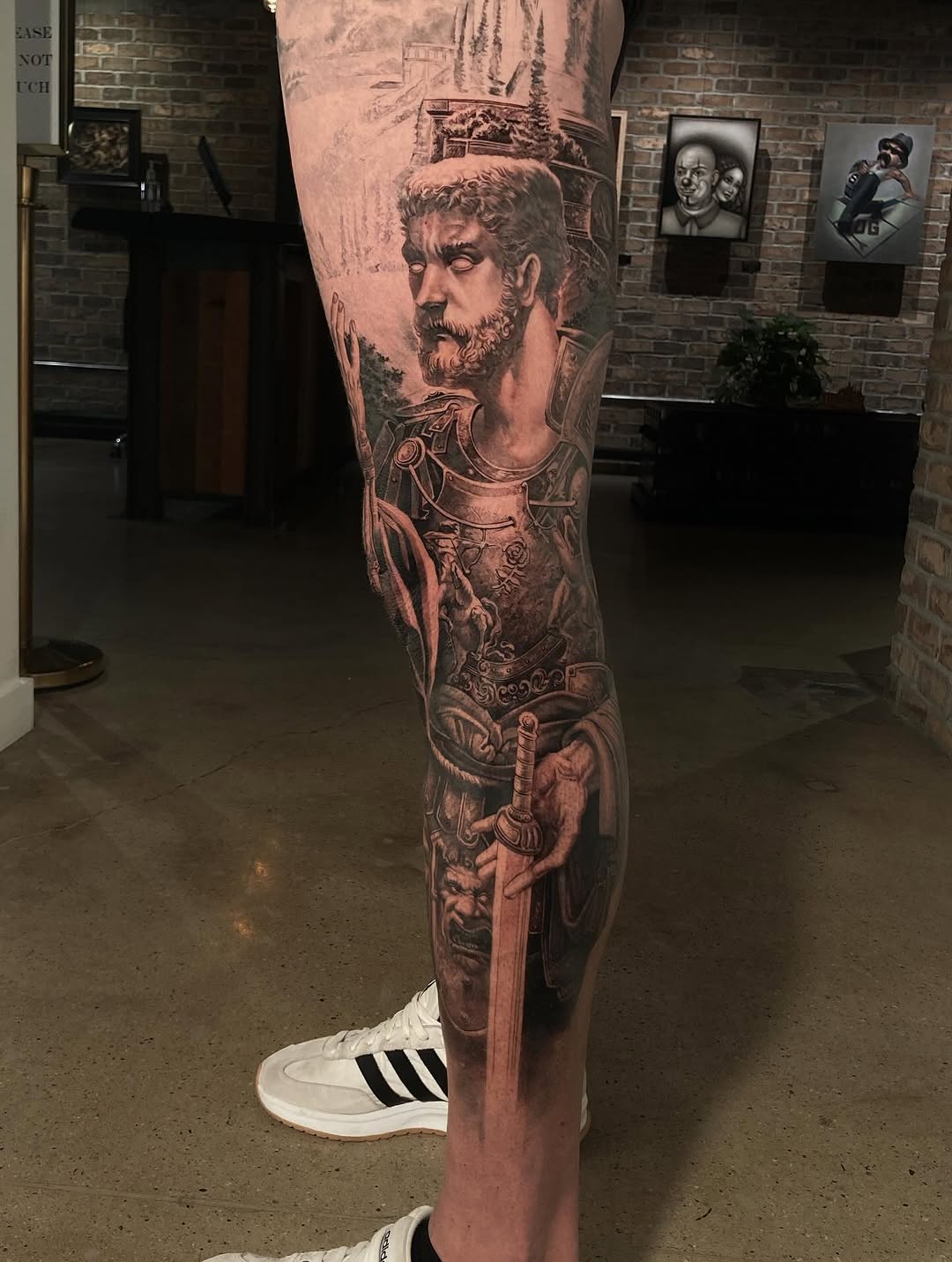 Stoic warrior portrait leg sleeve in black-and-grey