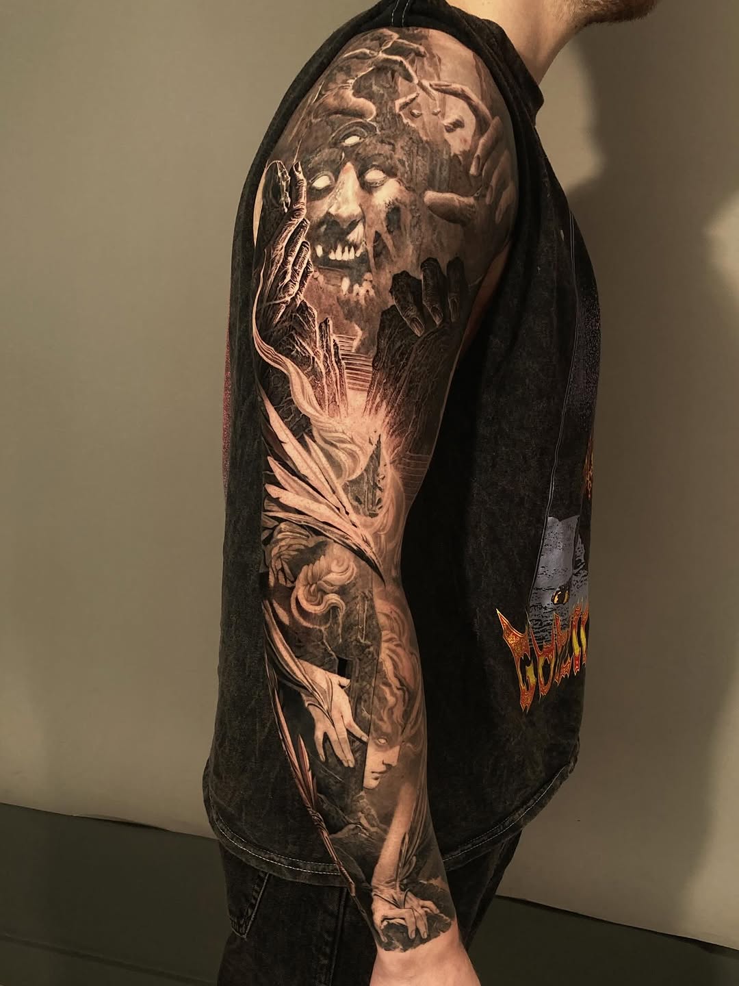 Full-sleeve realism horror portrait tattoo, arm