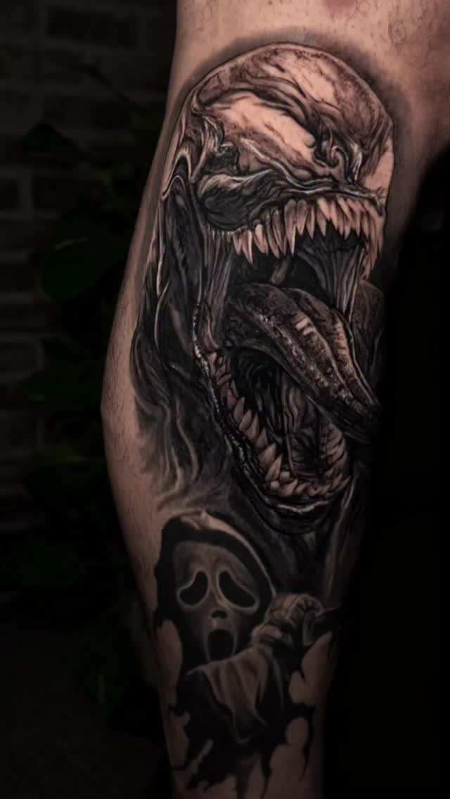 Black-and-grey Venom portrait with skull, leg
