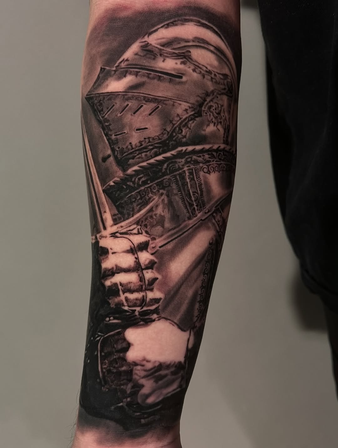 Medieval knight helmet portrait, forearm