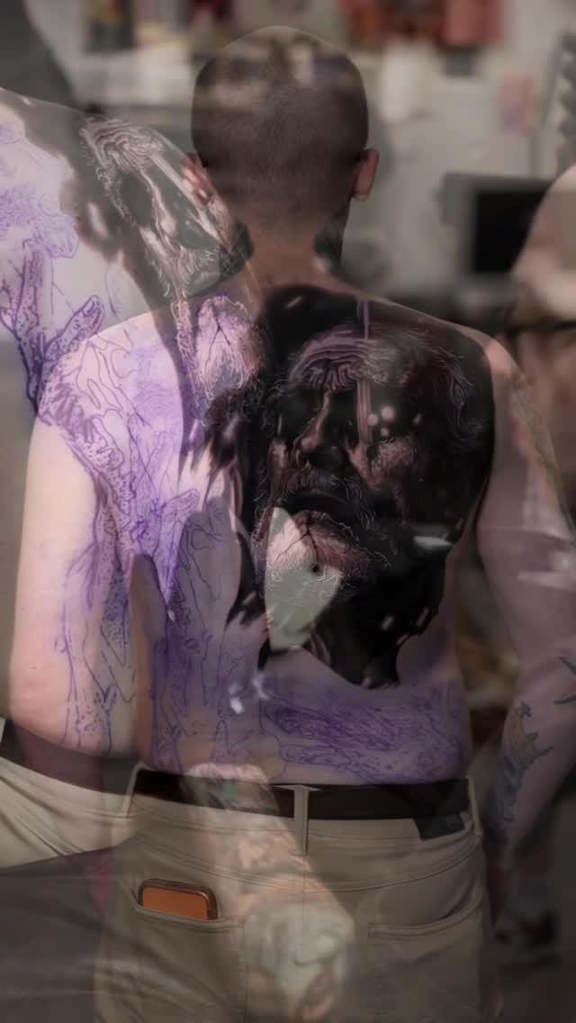 Black-and-grey dog portrait tattoo, back