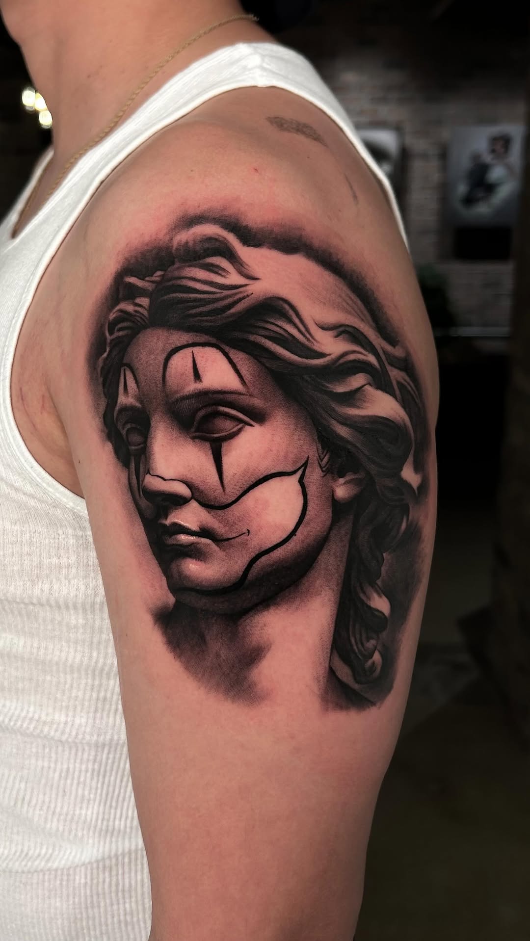 Surrealist portrait with geometric lines on shoulder