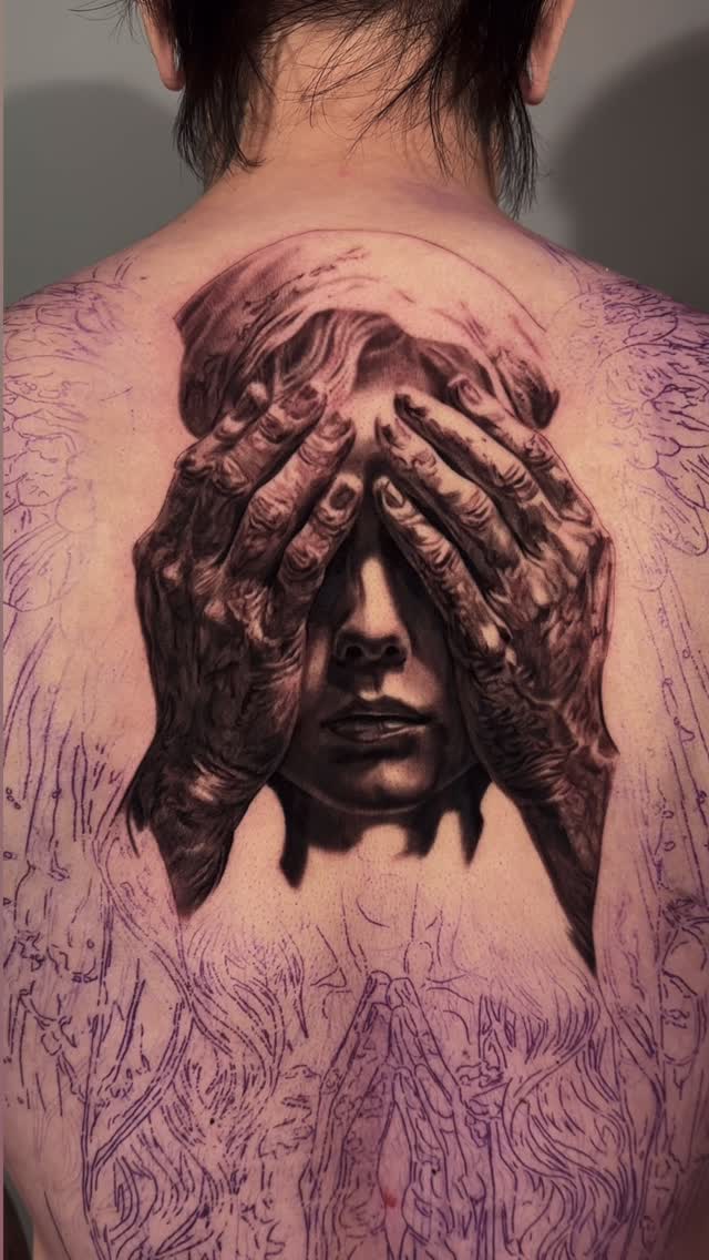Black-and-grey portrait back-piece with hands, realism
