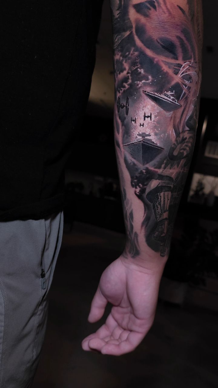 Star Wars sleeve tattoo with spacecraft and characters