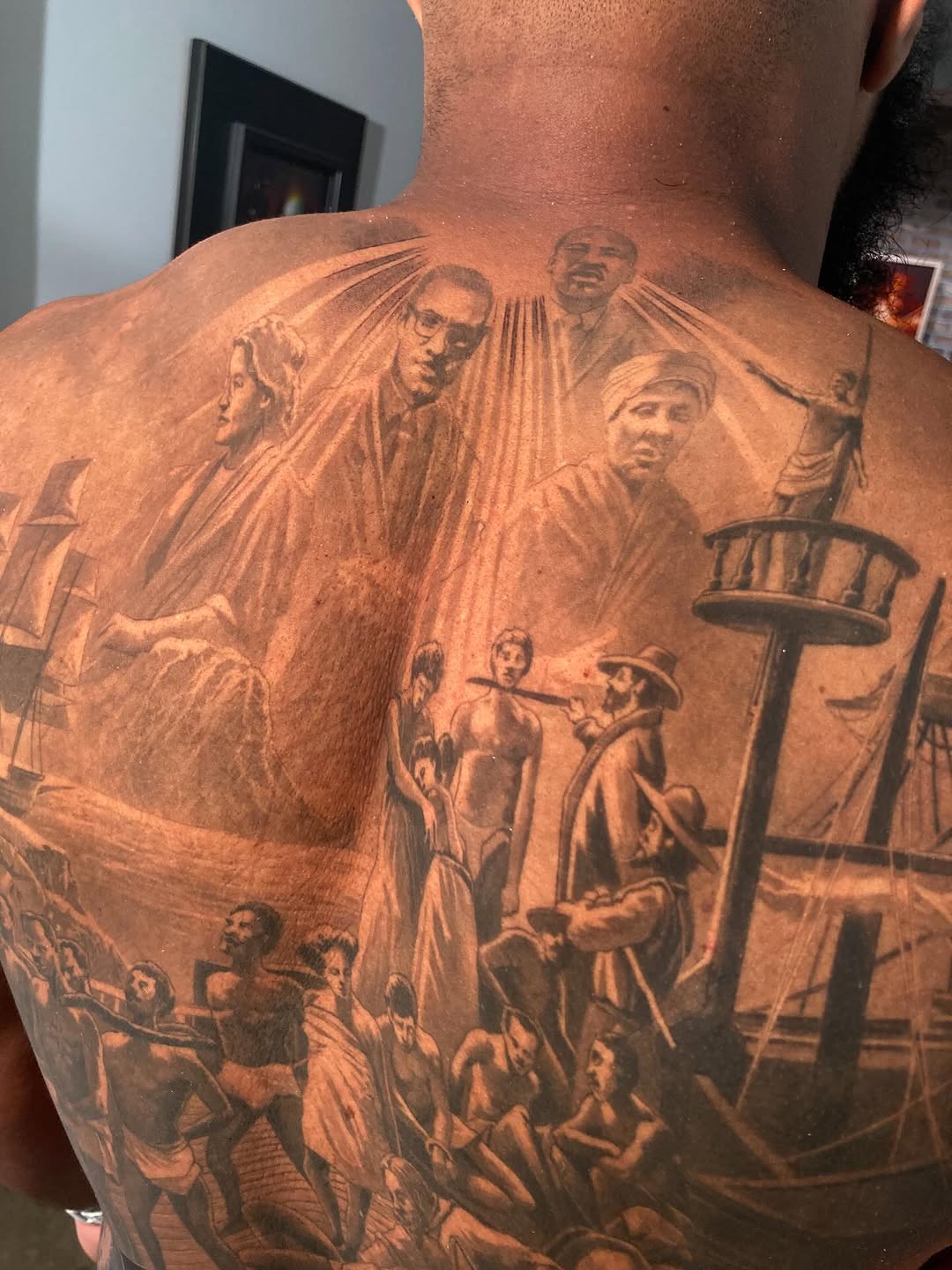 Black history back piece portrait tattoo