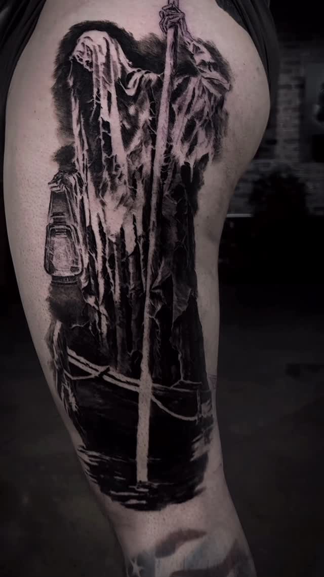 The Ferryman portrait leg tattoo in black-and-grey