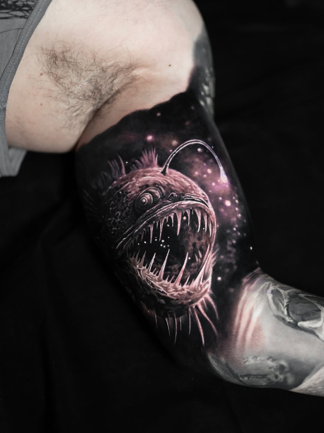 Anglerfish with purple galaxy, arm tattoo