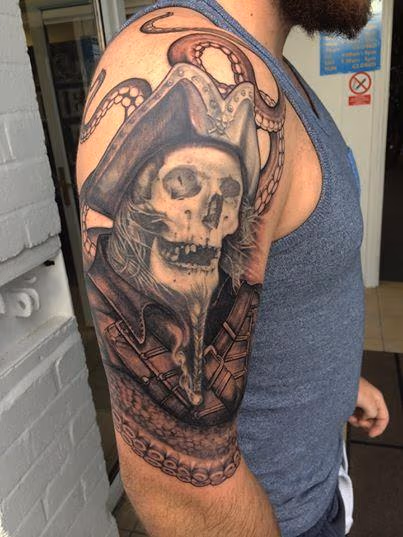 Black and Grey pirate tattoo on upper arm
