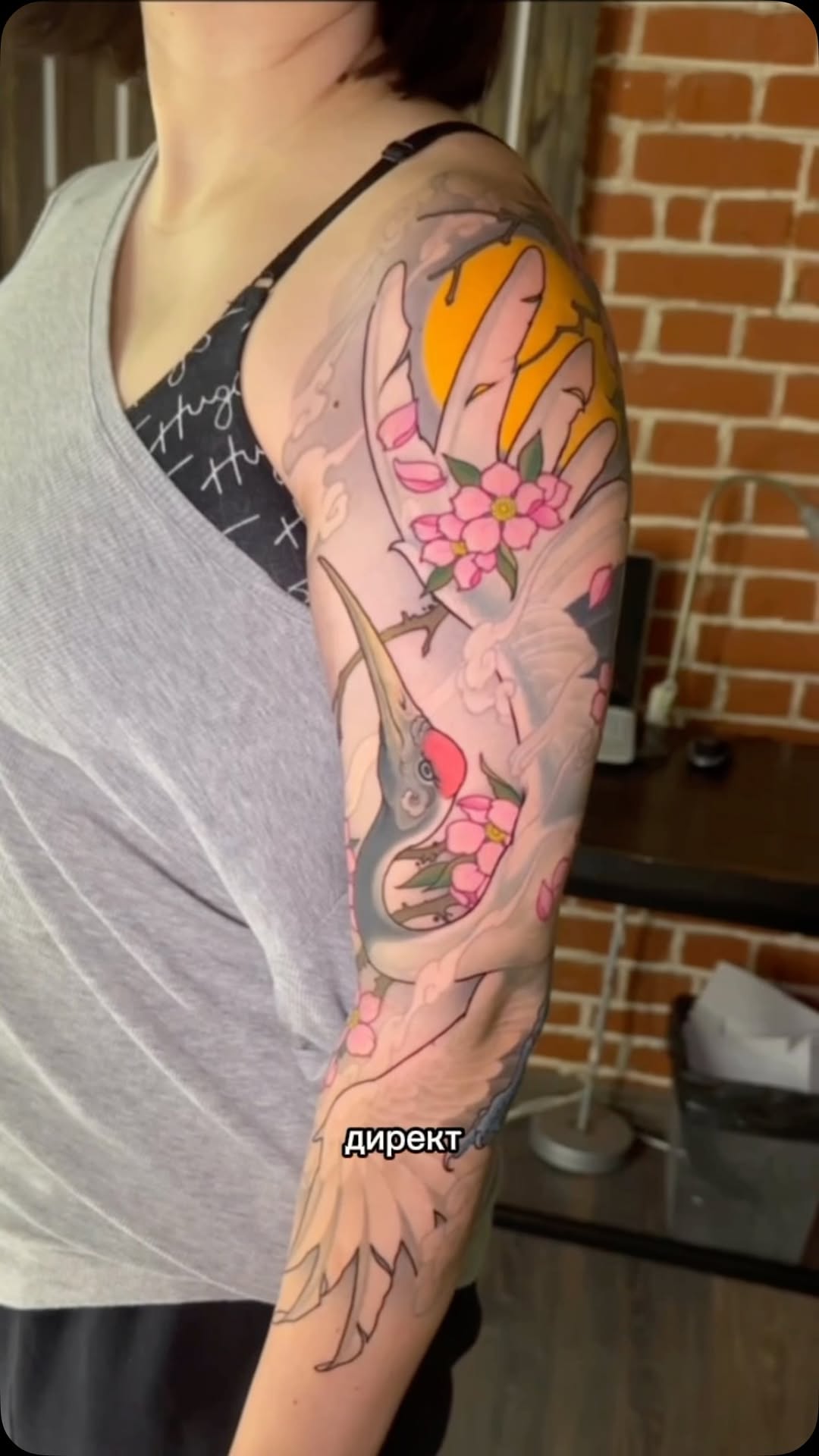 Floral arm sleeve with golden accents and birds