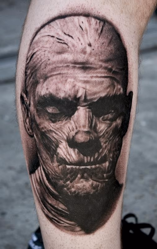 Black and Gray Mummy Portrait Tattoo