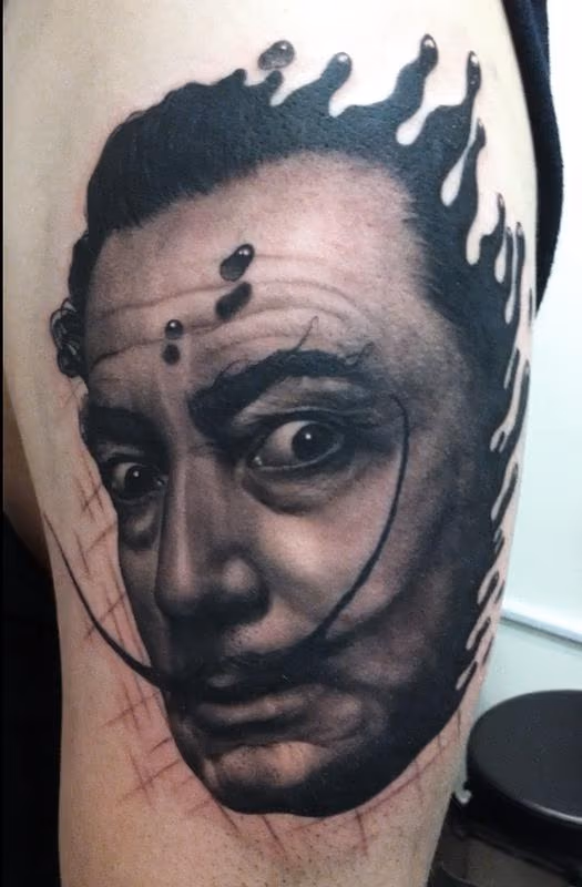 Black and Gray Dali Portrait Tattoo